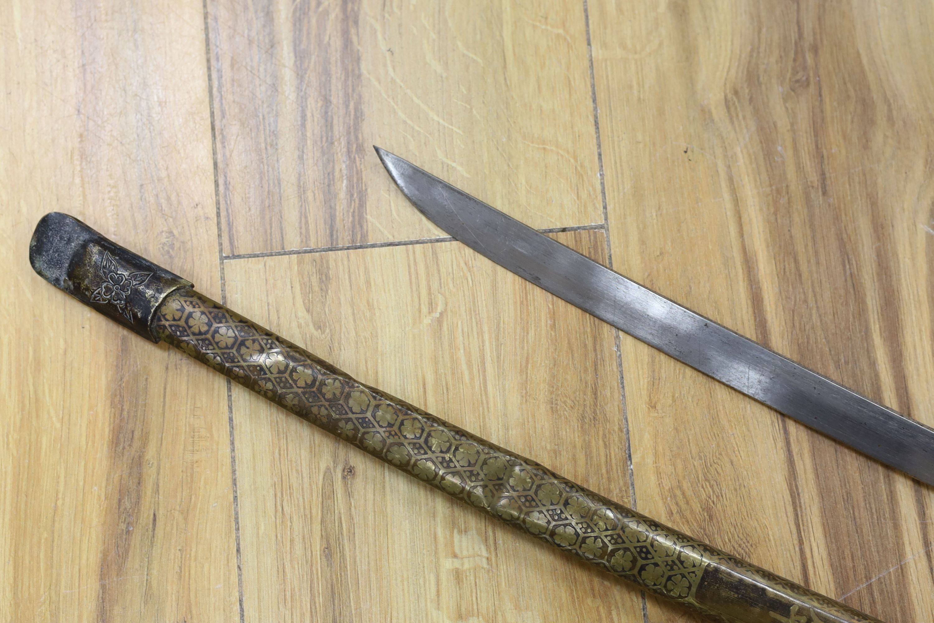 A Chinese sword, single edged blade 64cm long in etched brass scabbard